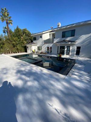 Beverly Hills, California Black Galaxy Finna Pebble and White Marble Flooring designed by Pacific Point Builders AFTER