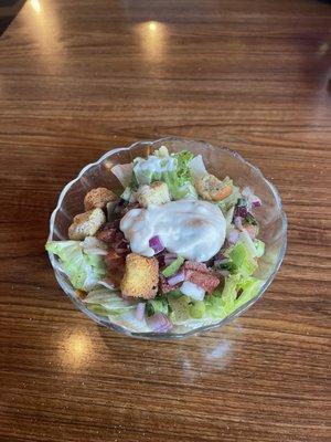 House salad.  If you elect to pay a $1.25 up charge, you can have this salad instead of fries / Tator tots.