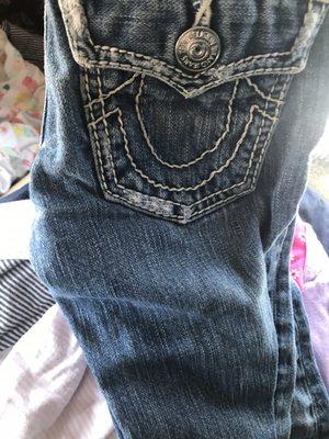 True religion jeans that has "holes"