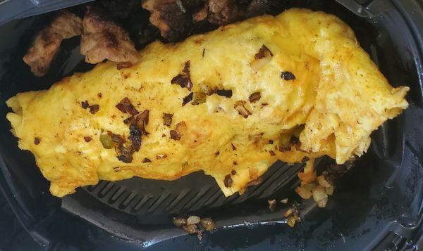 Despite the zoomed in appearance, many ingredients were lacking both in and outside of the omelet.