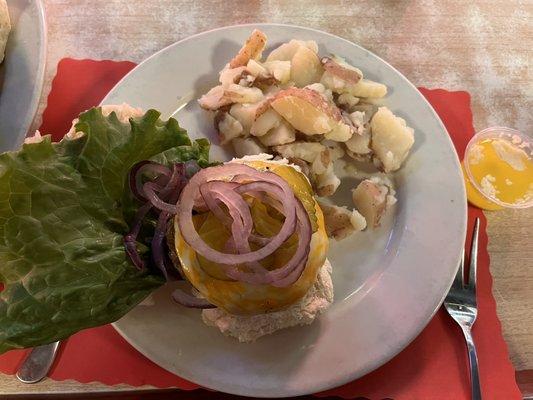 Cajun burger with a side of boiled red potatoes