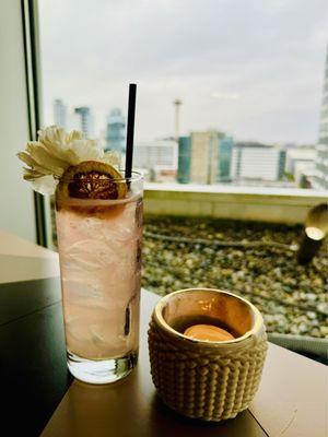 Dancing Delilah: grey goose, lychee, passionfruit, lemon, bitters served in a collins glass, on the rocks