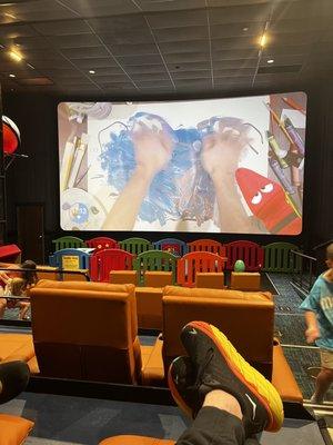 Loungers, (my feet), toddler play area and screen.