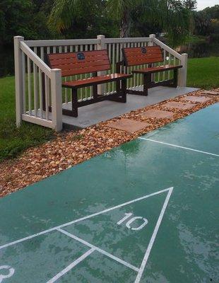 Tan vinyl picket surround for a shuffle board court