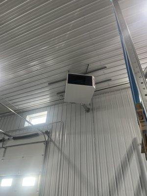 Recently installed hanging gas shop heater. 1 of 4 installed in a large shop with 20' sidewalls.