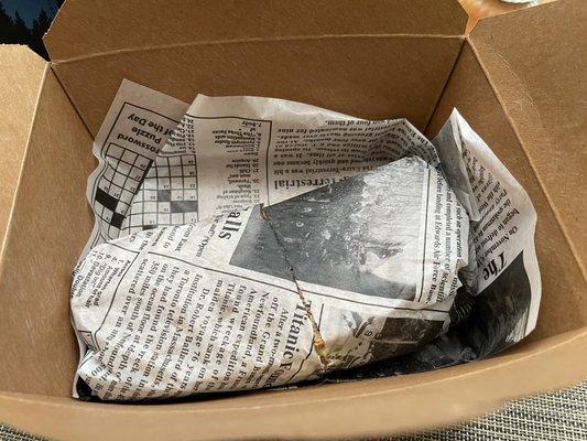 This is how it looked when I unboxed it.custom parchment paper made to look like old newspaper, classy!