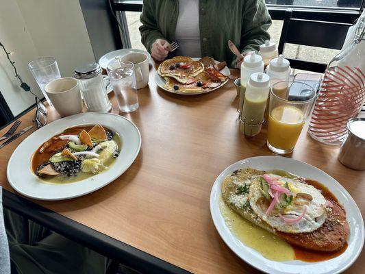 Left- huevos divorcidads back middle- pancakes and right- breakfast hurache