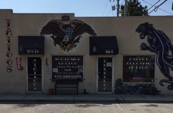 This is what the outside of the tattoo shop looks like all hand painted !!