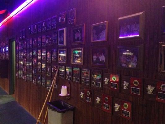 All walls are covered with award plaques. Note chalk on the left.