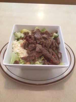 Chopped Greek salad with gyro meat.