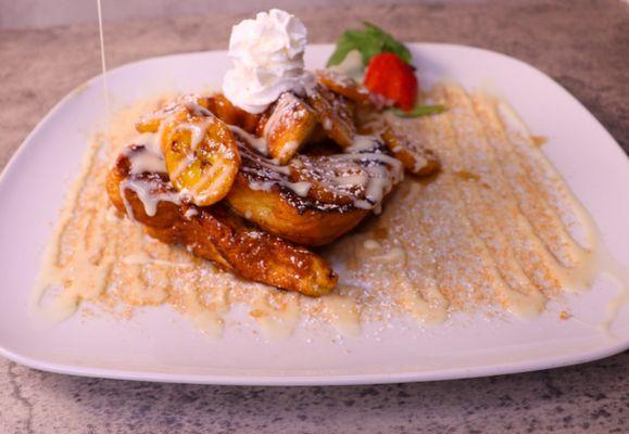 Cinnamon crunch french toast covered in a Mobay Spice creamy flavored house made rum sauce