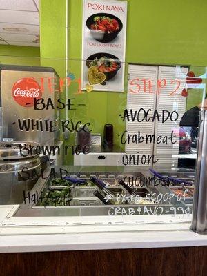 Step 1 - Base White Rice  Brown Rice Salad Half/Half  Step 2  Avocado Crabmeat Onion Cucumber *extra scoop Crab & avocado .99$*