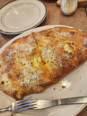 Pepperoni and onion calzone