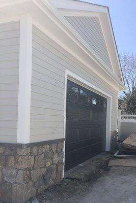 Black garage door installed by G&M