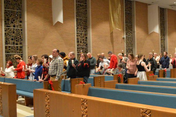 Lighting the candles during the singing of Silent Night.