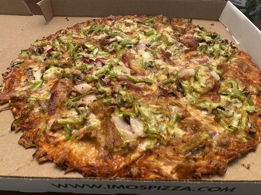 Supreme pizza: thin crust, provel cheese and pizza sauce (the standard)