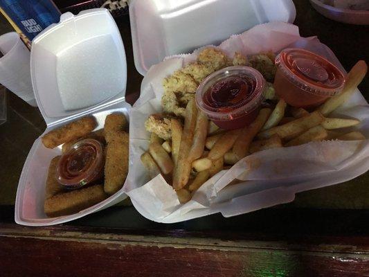 fried shrimp and fries and mozzarella sticks .