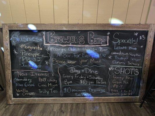 Chalk board with some of the specials that hangs behind the bar! Stop in and see what we have going on