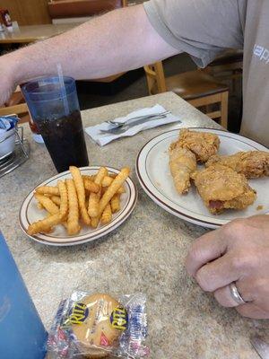 4-piece dark meat broasted chicken with french fries.