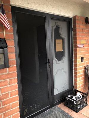 This is my custom security screen door. I wanted to share how they installed it around the brick.