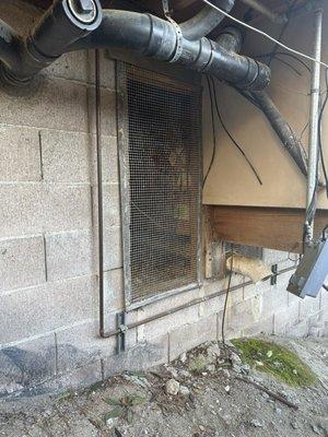 Crawlspace door after repair. Brandon found rodents under the house as well as in the attic.