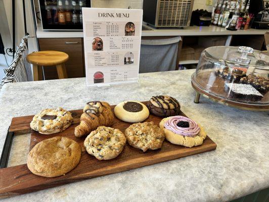 S'mores, Choc chip croissant with Nutella, Twix, Mocha, snickerdoodle pumpkin, choco chip, oatmeal butterscotch, lemon w/ blackberry icing.