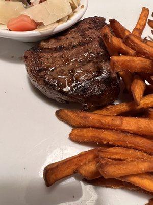 Sirloin steak with sweet potato fries and cucumber/ tomato salad