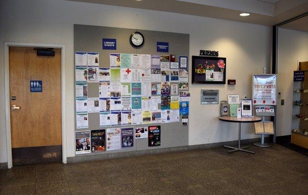 Notices about current programs and other activities offered in Pima county are posted near the doors.