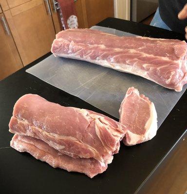 Pork loin being portioned