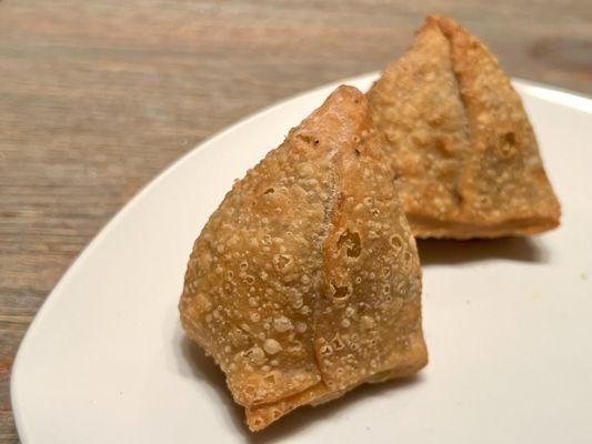 Samosa. Densely crisp outer shell, with potatoes and vegetables inside. It's a heavy appetizer, so share it!