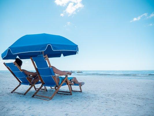 Enjoy the day in comfortable beach chairs and an umbrella.