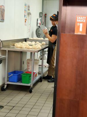 I pkd up a pizza here today and saw this guy working  pizza dough not wareing plastic gloves ! Wow !