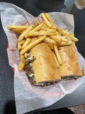 Steak and cheese with fries.