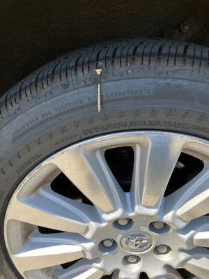 Run flat tire with screw as road hazard