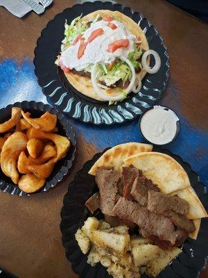 Gyro platter with potatoes and Gyro on pita