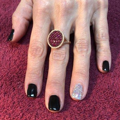 Black gel polish with silver holographic glitter accent