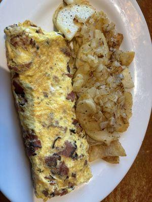 Pastrami and cheese omelette with home fries with onions