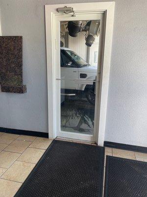 Car going through wash.  Photo taken on the inside waiting area