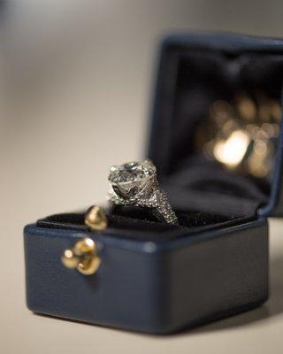 Bespoke platinum antique-inspired ring design for client's heirloom diamond