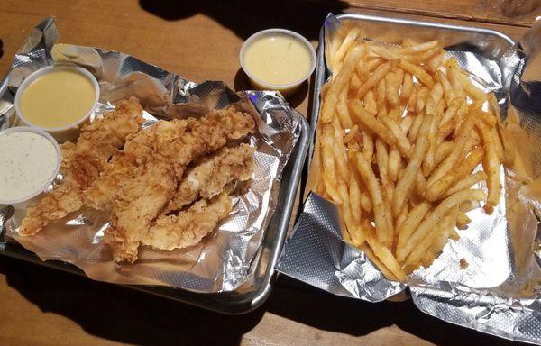 an underwhelming order of "enough to share" chicken tenders and a basket of fries