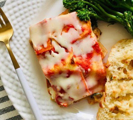 Vegetarian Lasagna with broccolini and garlic bread