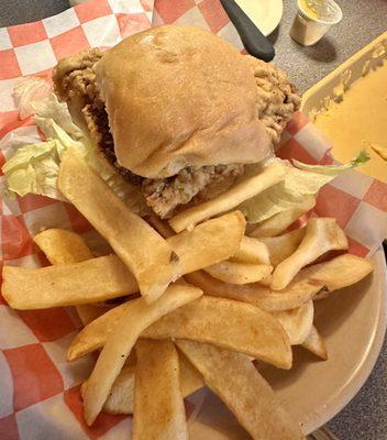 Chicken fried steak sandwich and fries.