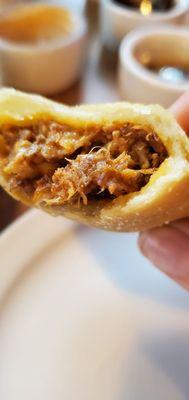 The filling in the empanada was tender and flavorful.