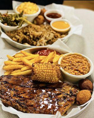 Half rack of ribs with a pulled pork dinner behind