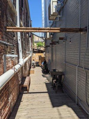 Additional seating in small alley to the back