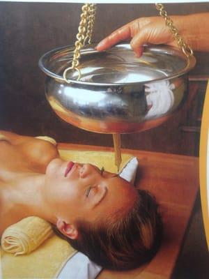 Shirodhara: gentle pouring of warm herbal oil over the forehead. Nourishes the nervous system, bringing deep relaxation.