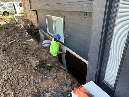 Waterproofing system application and crack repair (adhesive sheet waterproofing system applied after this, not pictured.)