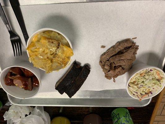 (Left to right) jalapeño cheddar sausage, jacked up mashers, ribs, brisket, coleslaw