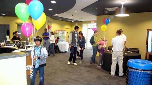 Community members mingle and linger in the lobby. 1/2013