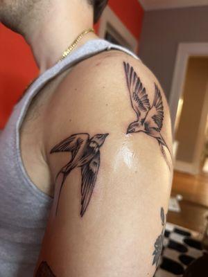 Two swallow tattoos by Ariana